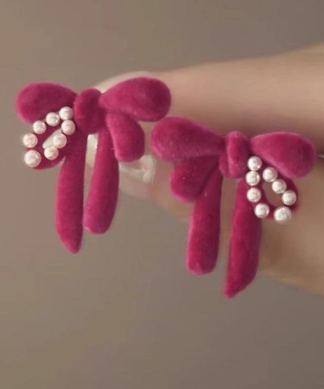 Cute Raspberry Powder Sterling Silver Flocking Pearl Bow Stud Earrings