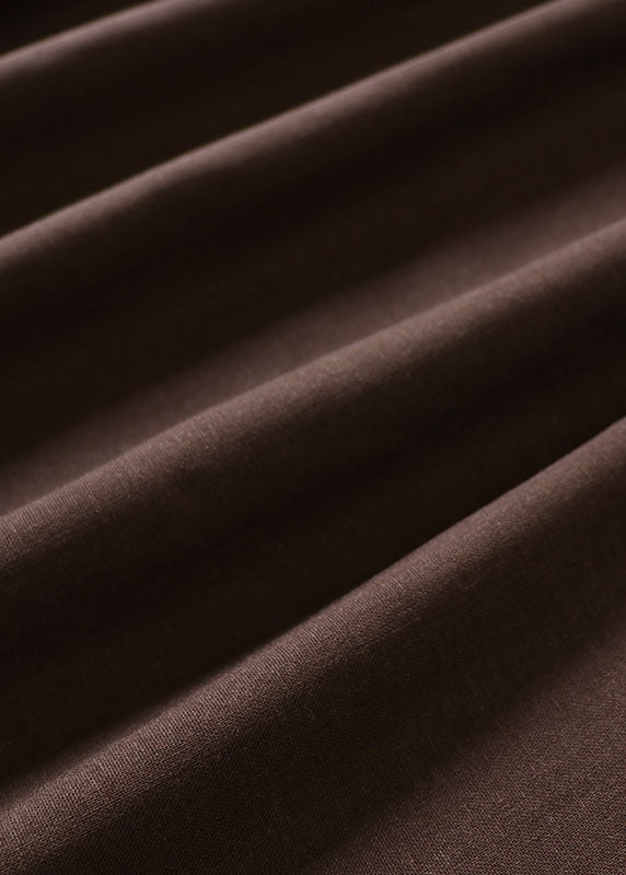 Stilvolles, ärmelloses Kleid mit Patchwork-Taschen und Kaffeeschleife